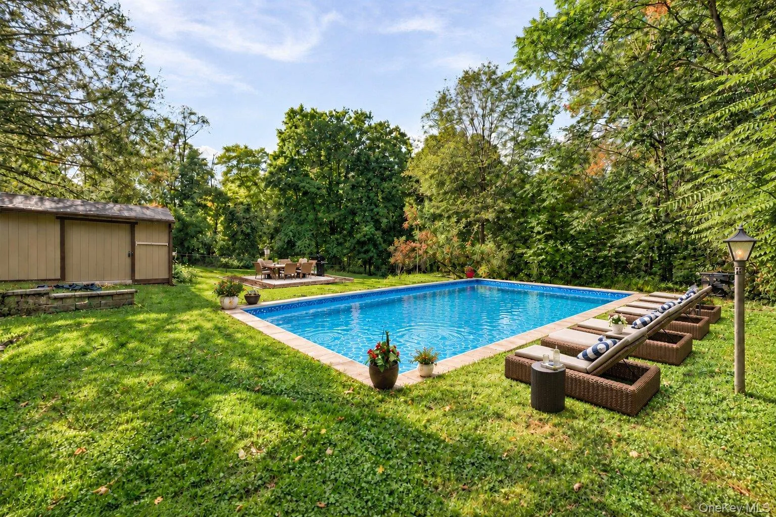 Virtually staged pool area highlighting the lounge space, surrounding greenery, and outdoor entertaining potential. Virtually staged pool area highlighting the lounge space, surrounding greenery, and outdoor entertaining potential.