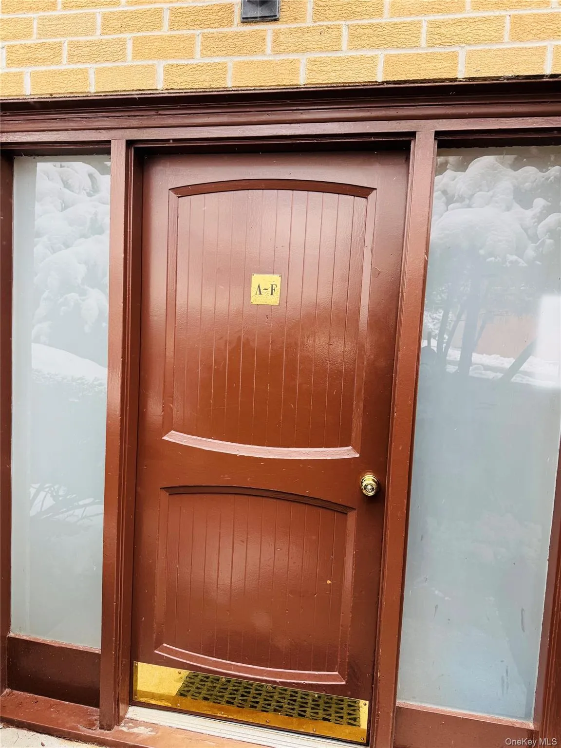 Brown entry door with side windows Brown entry door with side windows