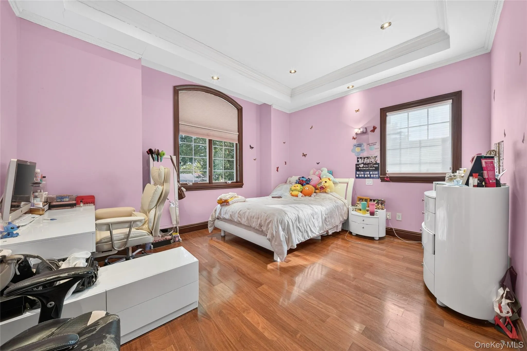 Hardwood-finish flooring throughout, recessed ceiling lighting, and crown molding Hardwood-finish flooring throughout, recessed ceiling lighting, and crown molding