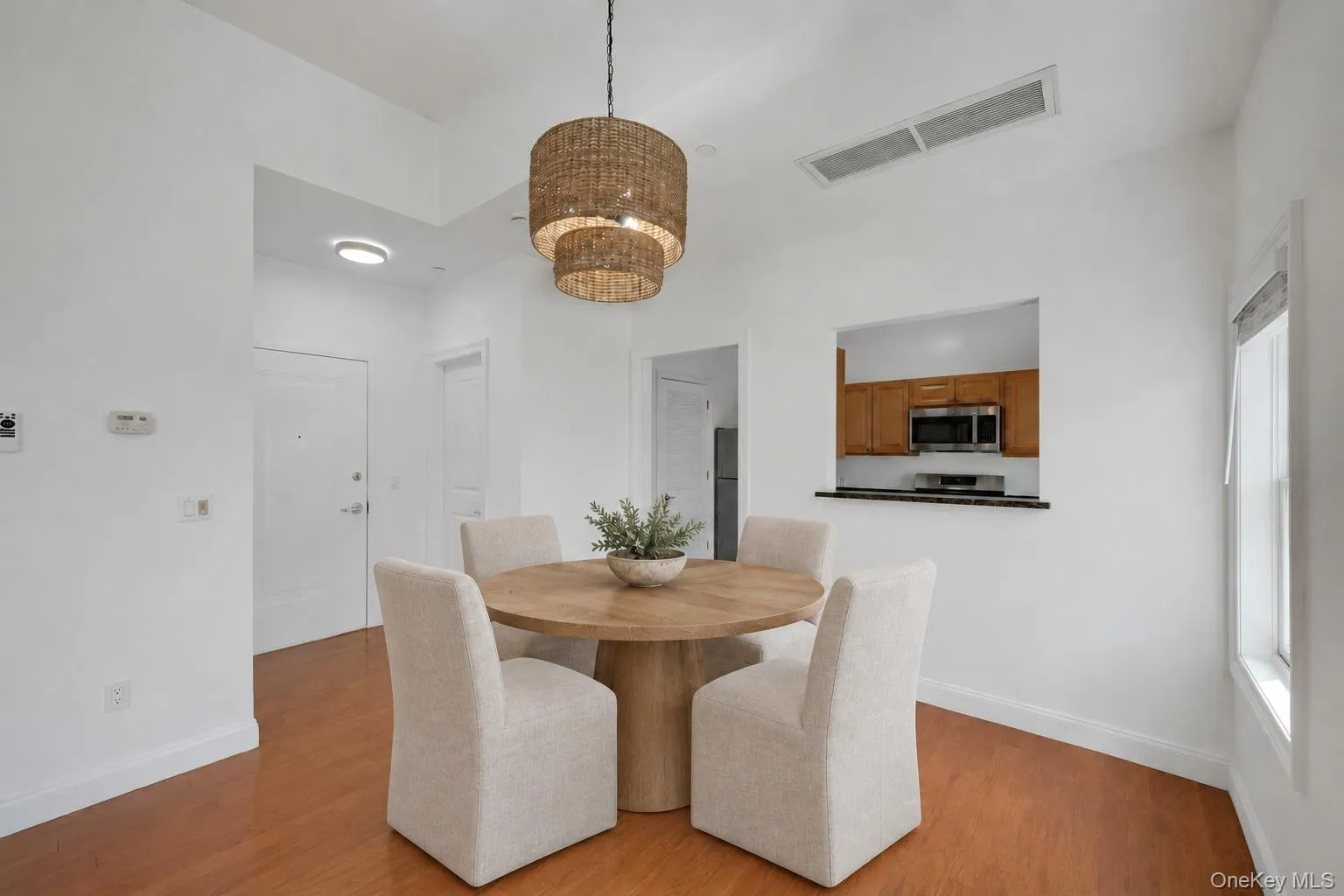 Entry foyer with open dining area and pass through to kitchen.Virtually Staged Entry foyer with open dining area and pass through to kitchen.Virtually Staged