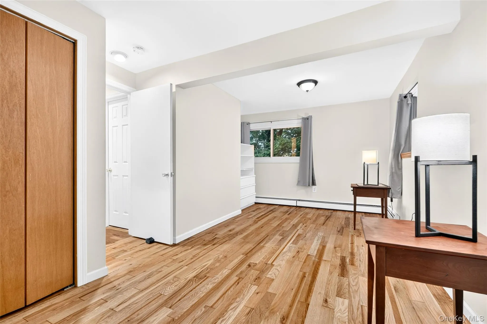 Hardwood flooring, painted interior walls, built-in shelving, wood-finish bi-fold closet doors, and recessed lighting Hardwood flooring, painted interior walls, built-in shelving, wood-finish bi-fold closet doors, and recessed lighting