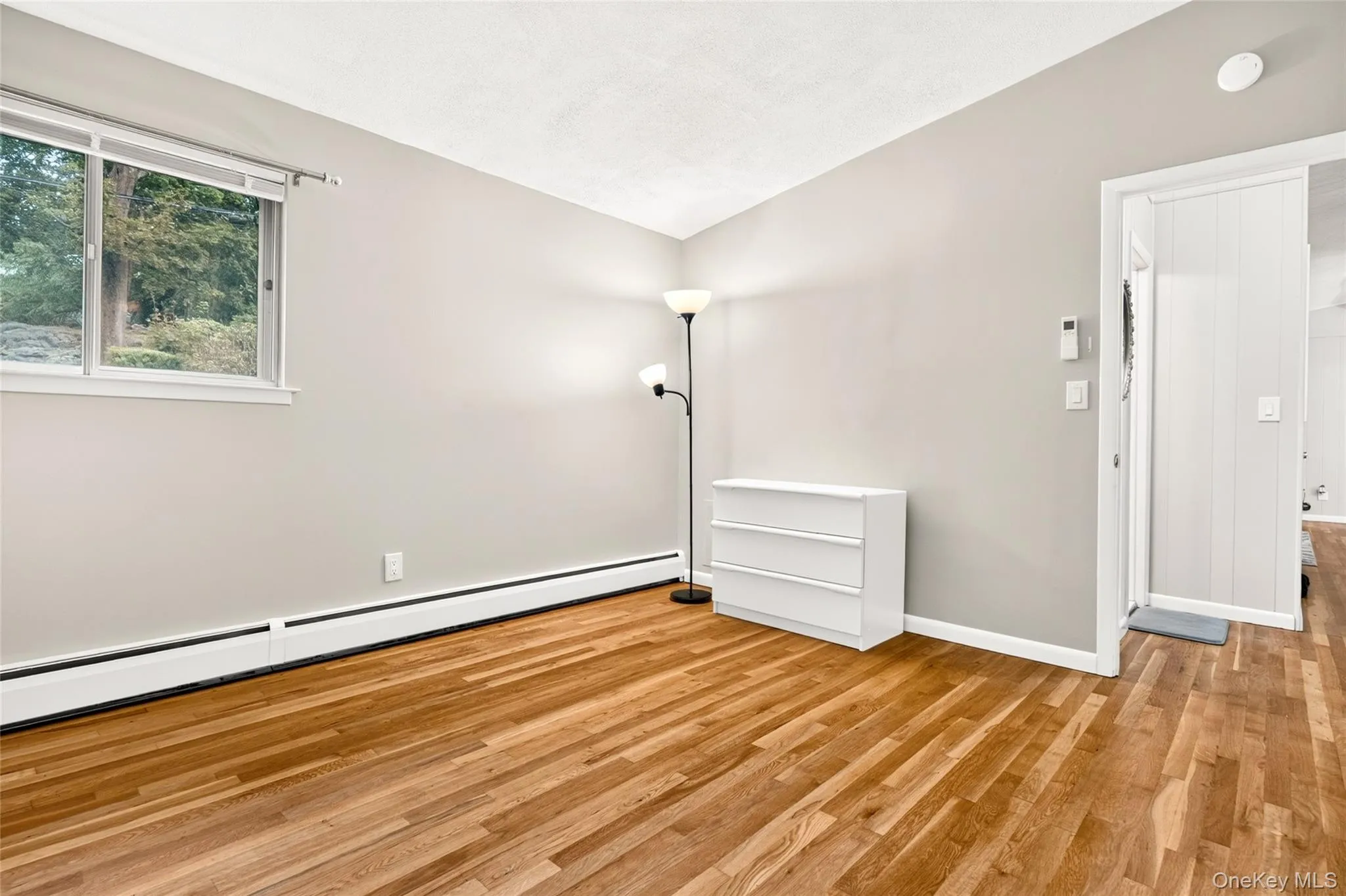 Wood-finish flooring with baseboard heating Wood-finish flooring with baseboard heating