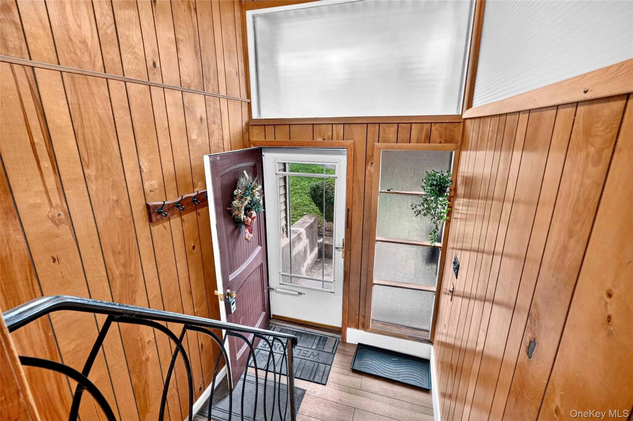 Wood paneling throughout the entry Wood paneling throughout the entry