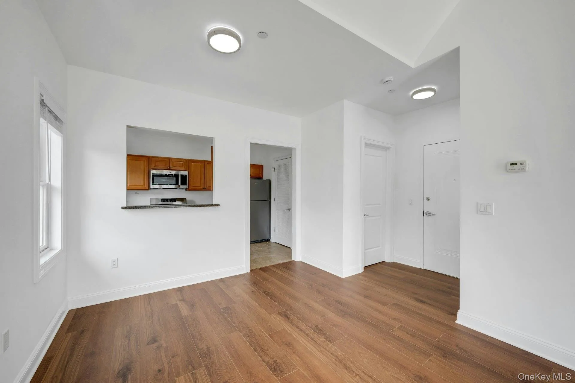 Entry foyer with open dining area and pass through to kitchen. Entry foyer with open dining area and pass through to kitchen.