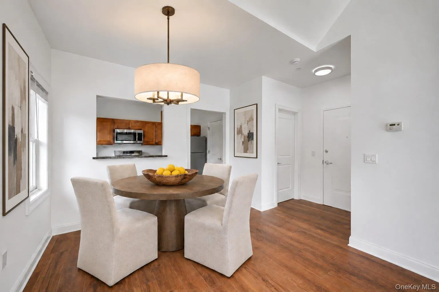 Entry foyer with open dining area and pass through to kitchen.Virtually Staged Entry foyer with open dining area and pass through to kitchen.Virtually Staged