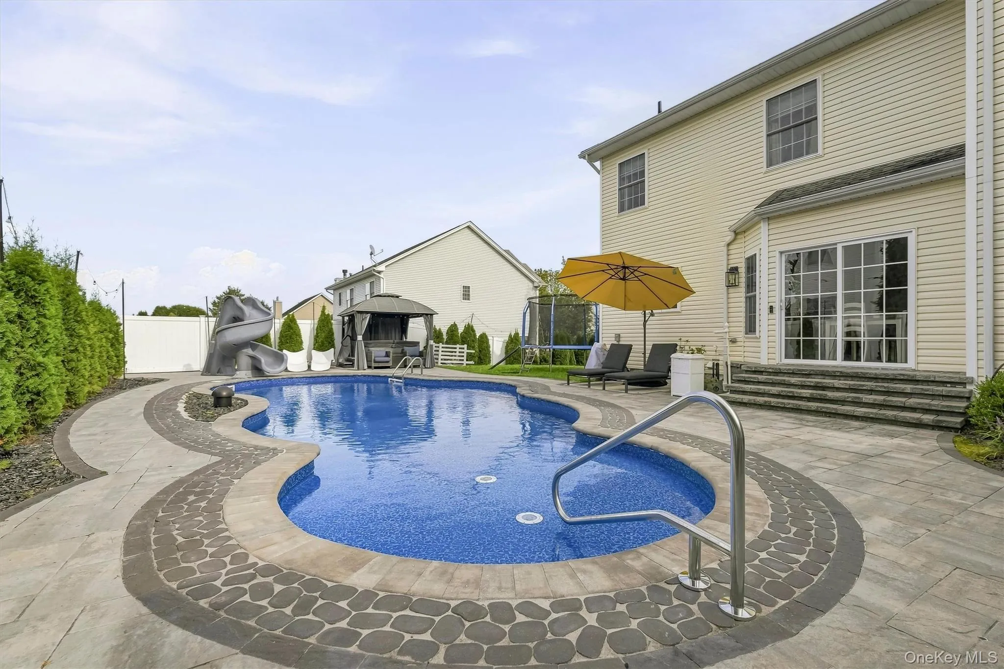 The pool has a twist, waterfall slide and a bubble feature! The pool has a twist, waterfall slide and a bubble feature!