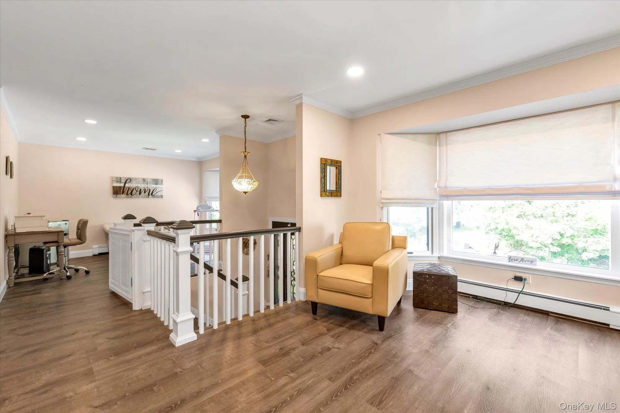 Sprawling living room area with large bay windows. Sprawling living room area with large bay windows.