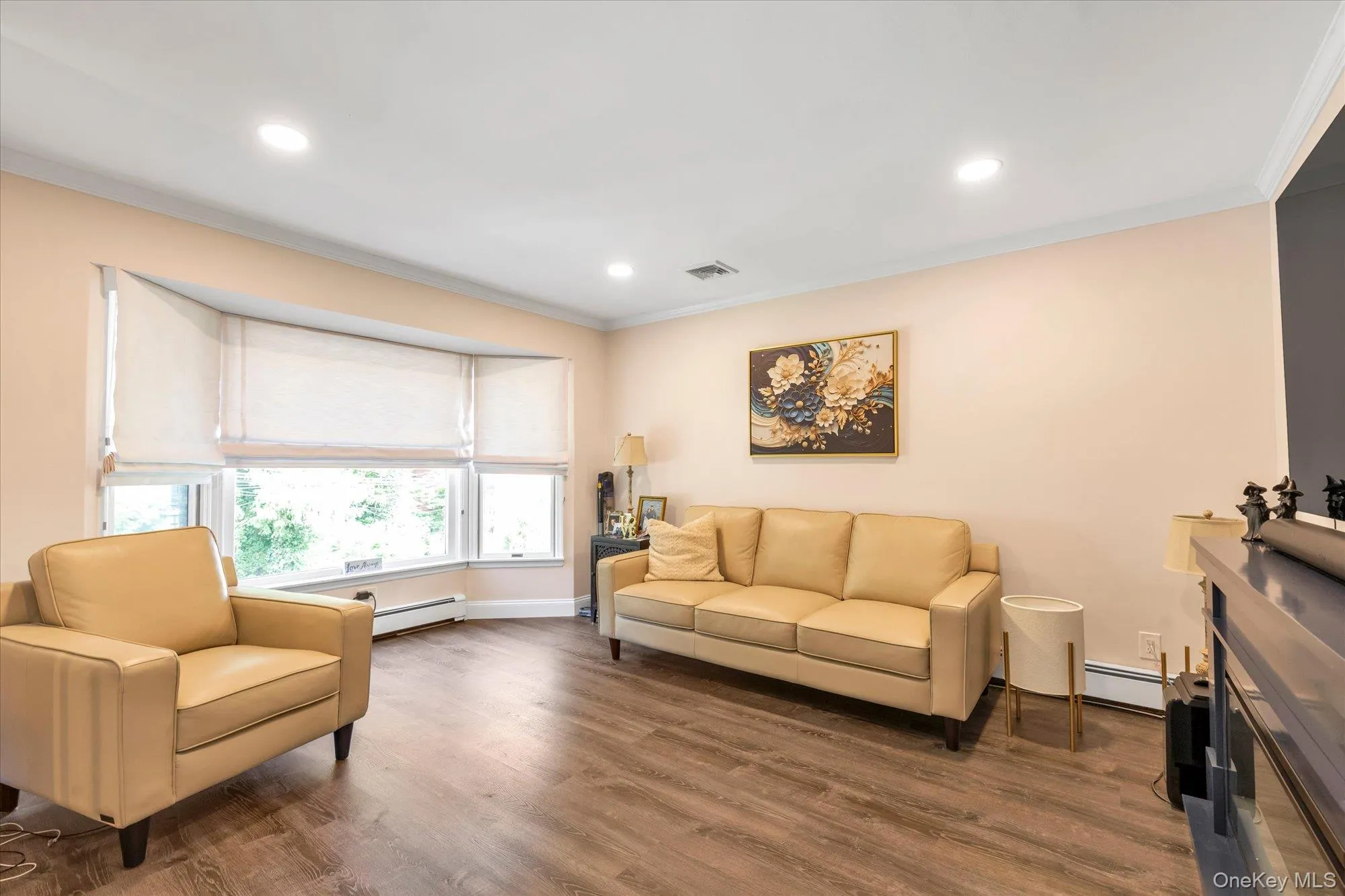 Bay window with multiple panels, wood-finish flooring, recessed ceiling lighting. Bay window with multiple panels, wood-finish flooring, recessed ceiling lighting.
