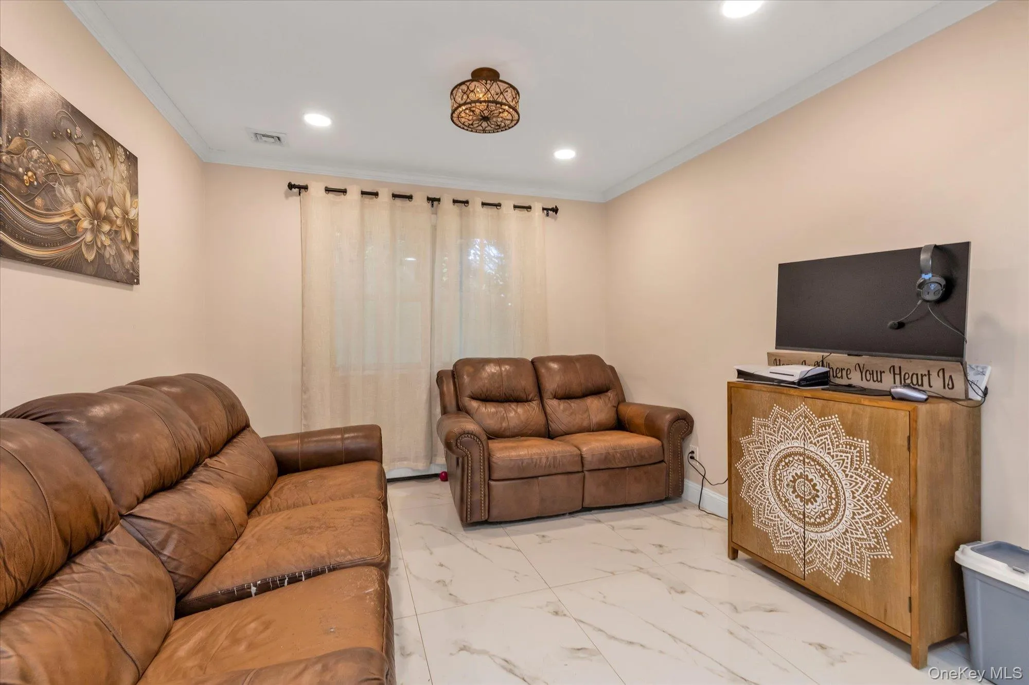 Recessed lighting, crown molding, and a porcelain floors throughout lower level Recessed lighting, crown molding, and a porcelain floors throughout lower level