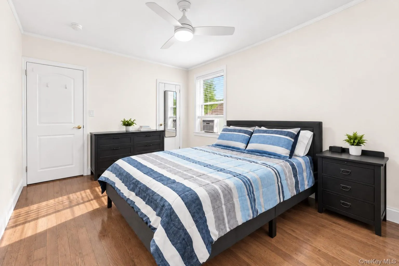 Primary Bedroom w. Hardwood Floors Primary Bedroom w. Hardwood Floors
