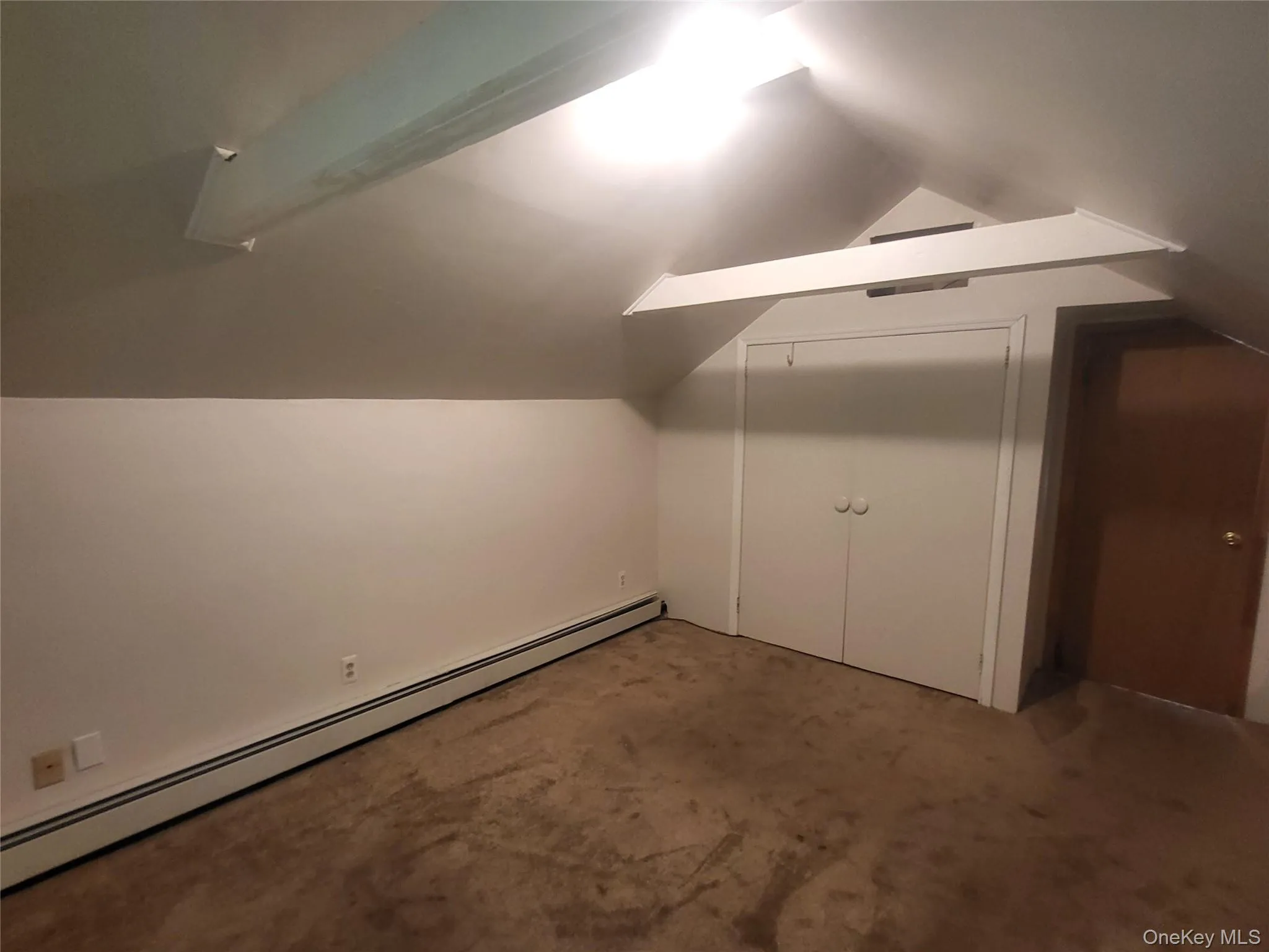 Primary bedroom with double closet and cubby space above Primary bedroom with double closet and cubby space above