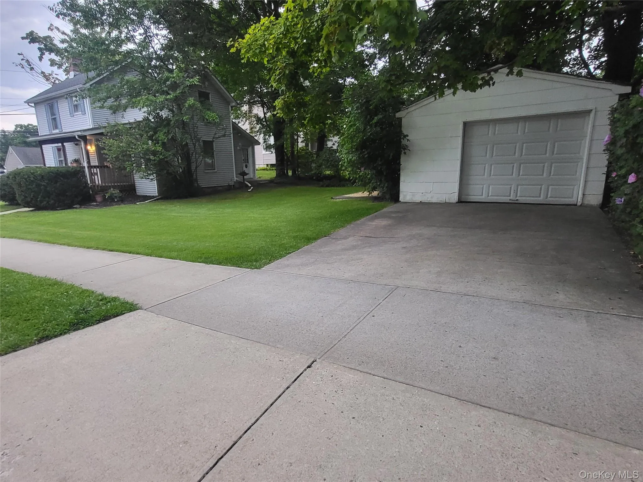 Driveway, garage, and yard Driveway, garage, and yard