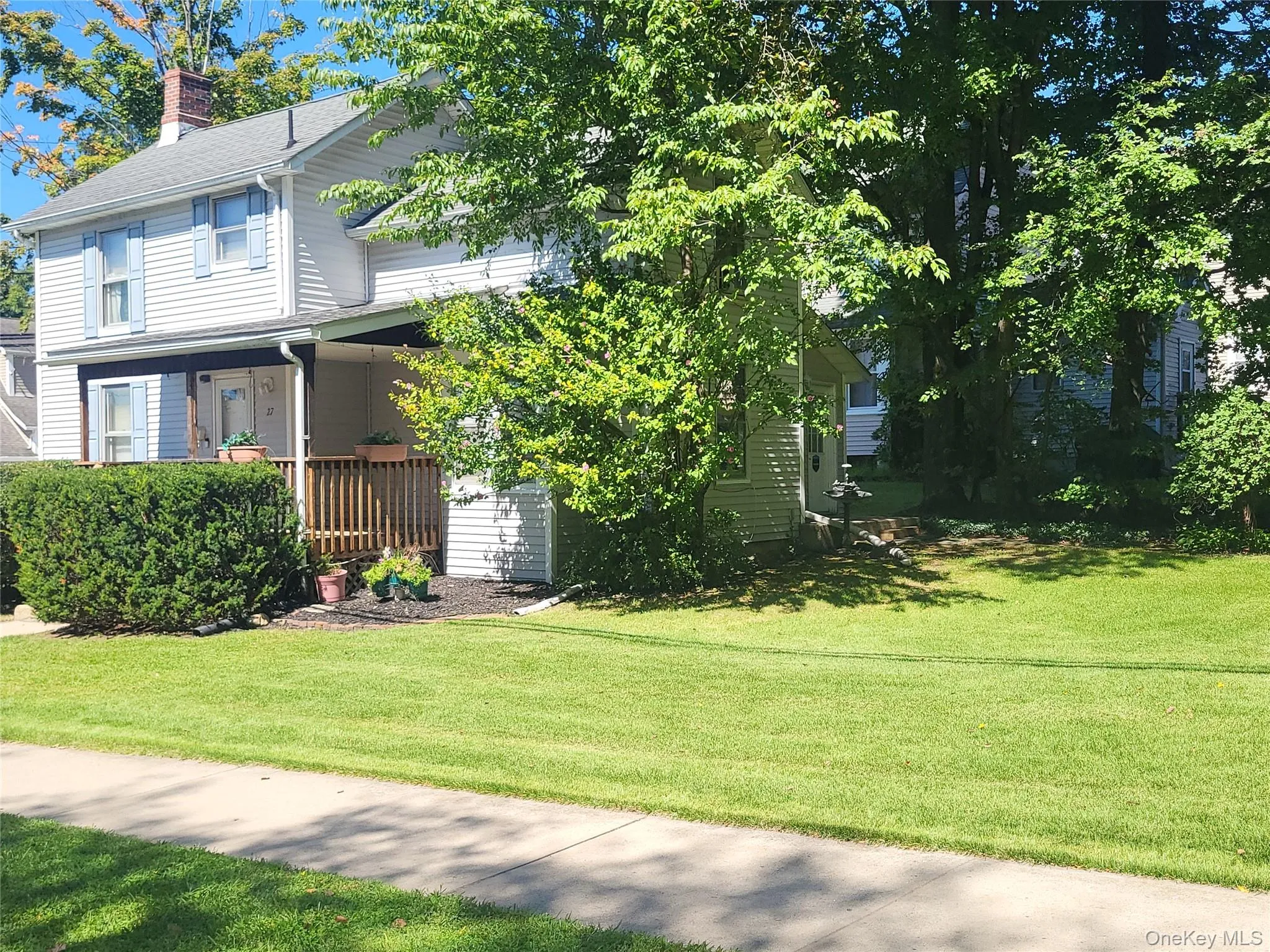 Side view with level manicured yard Side view with level manicured yard