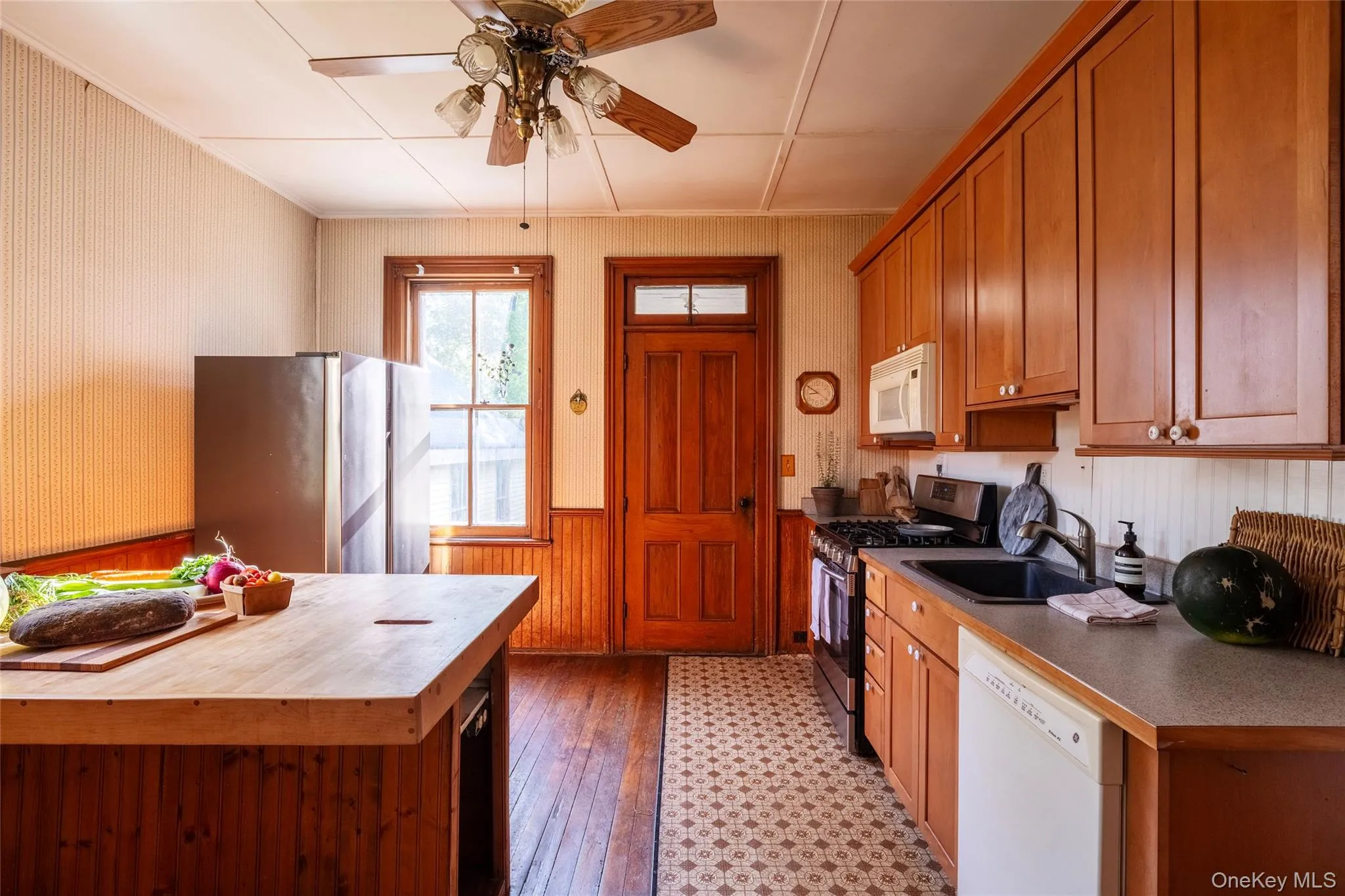 Kitchen as seen from dining room looking toward back door Kitchen as seen from dining room looking toward back door