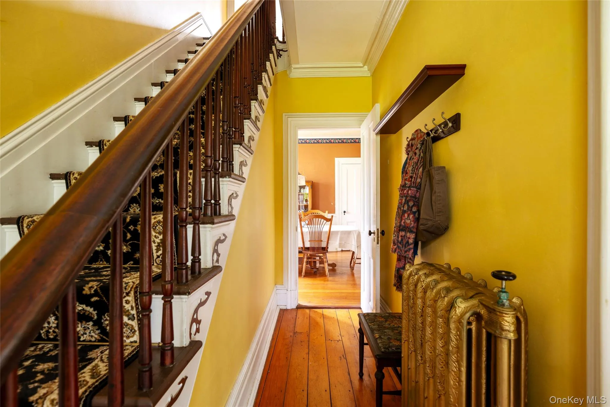 Front entry hall leading to dining room Front entry hall leading to dining room