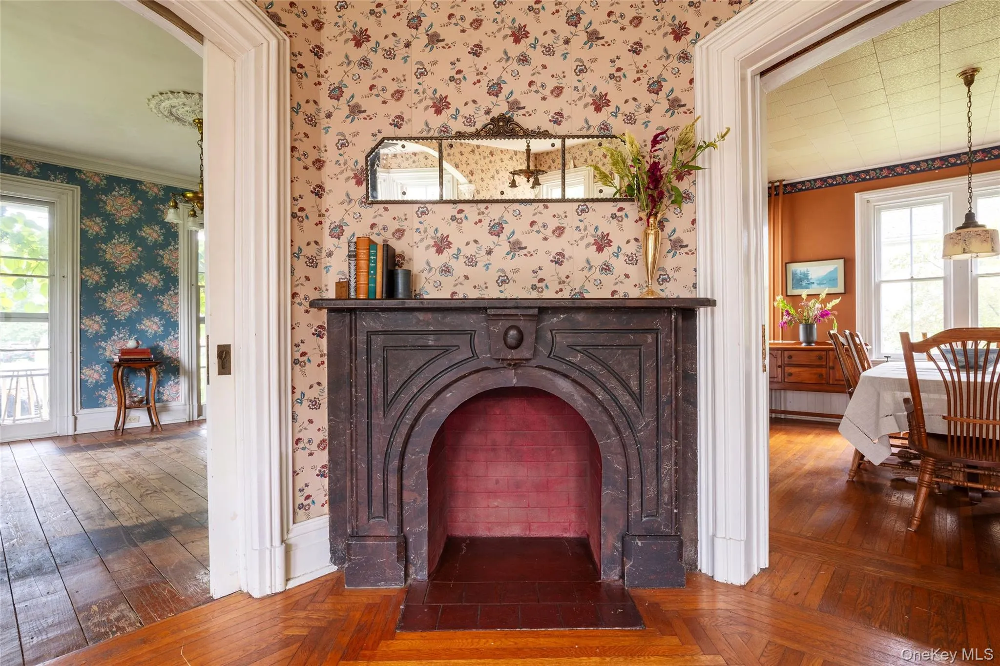 Living room with views into front parlor and dining room Living room with views into front parlor and dining room