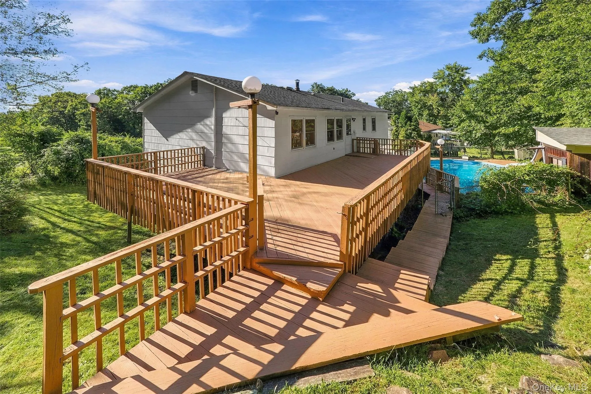 Multi-level wood deck with a full railing system Multi-level wood deck with a full railing system