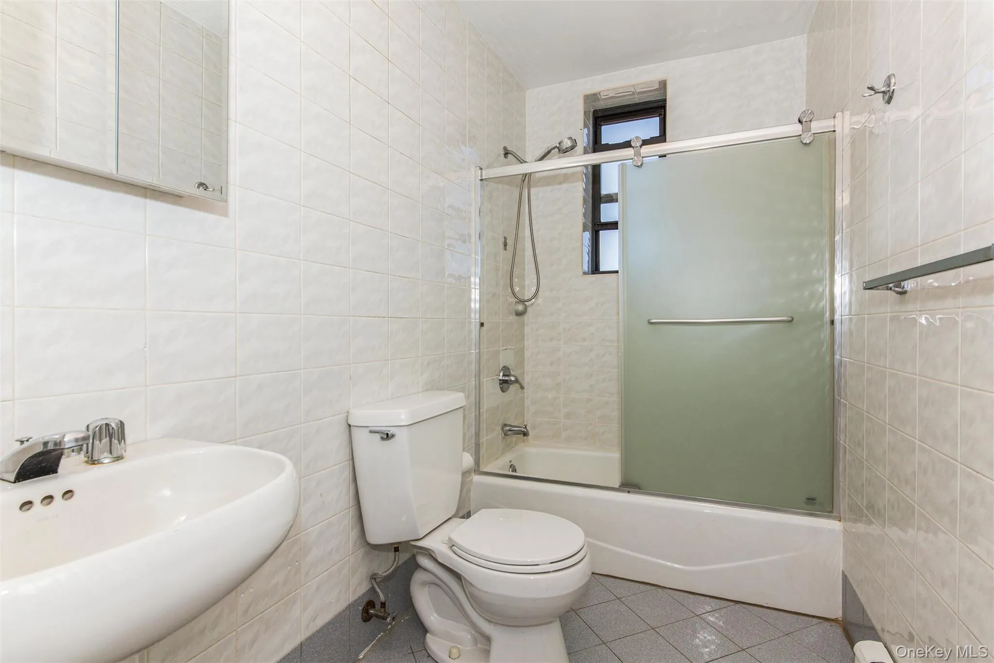 Bathroom with combination Tub/Shower. New medicine Cabinet & Lighting. Bathroom with combination Tub/Shower. New medicine Cabinet & Lighting.