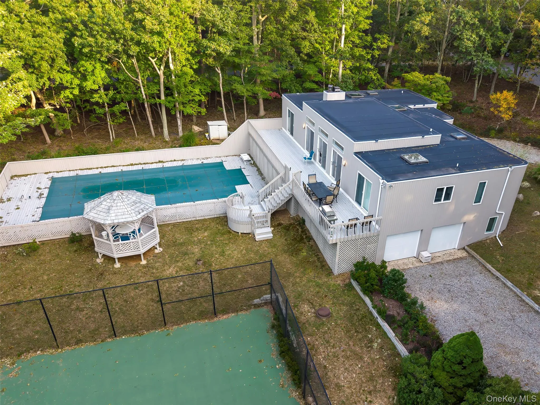 sky vista of property plan with tennis court and pool on 1.6 acres.