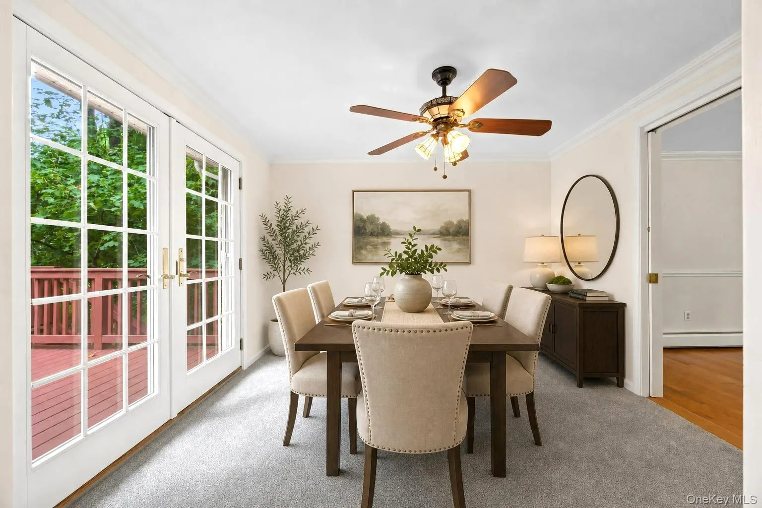 Virtually staged dining room with french doors out to deck Virtually staged dining room with french doors out to deck