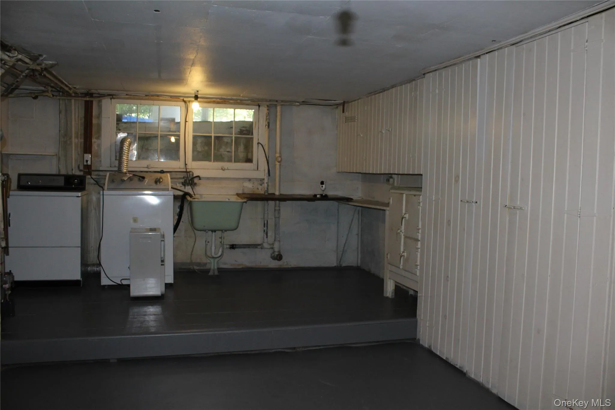Washer & Dryer with Plenty of storage and slop sink Washer & Dryer with Plenty of storage and slop sink