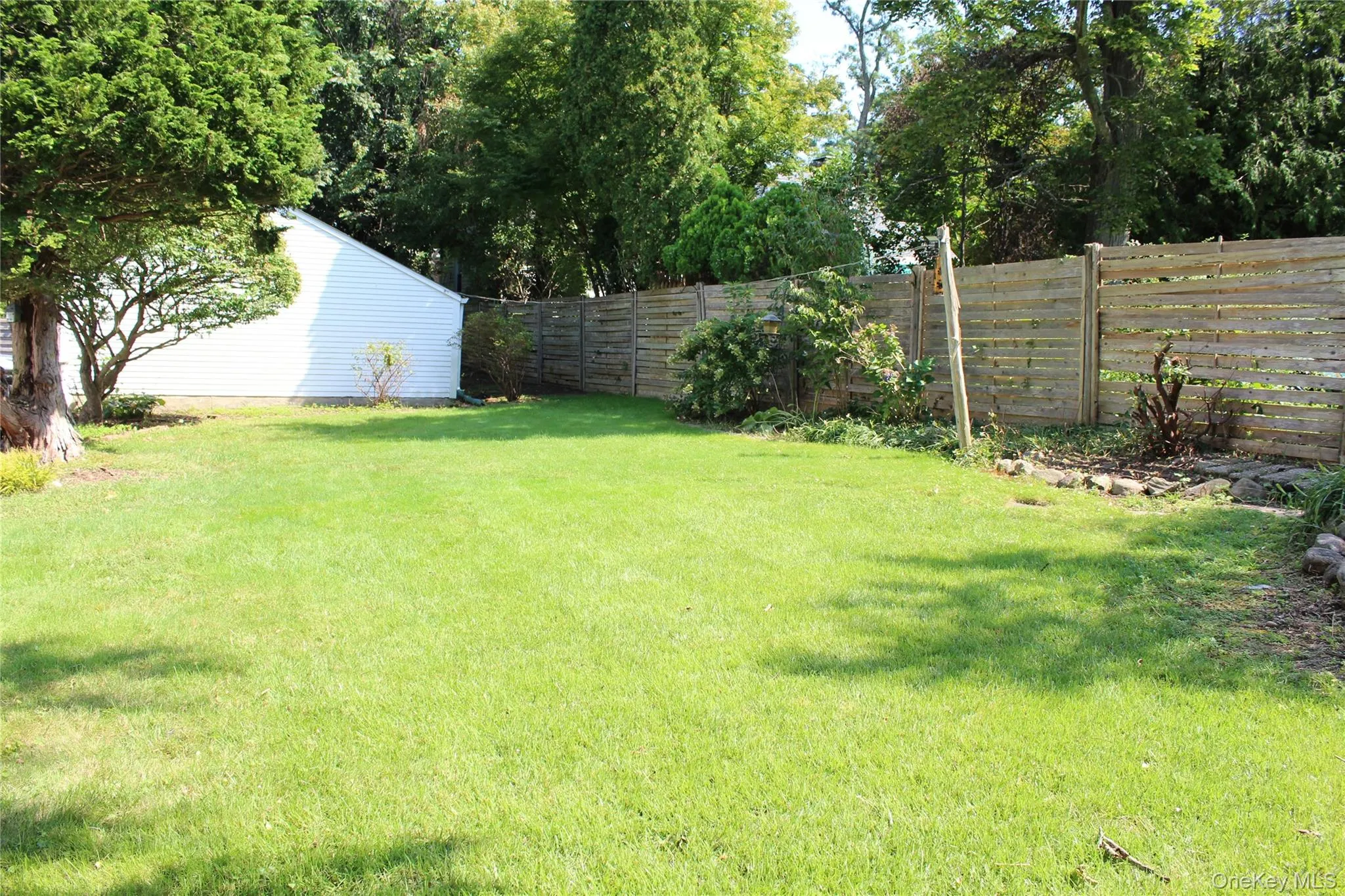 Expansive lawn area with mature trees Expansive lawn area with mature trees