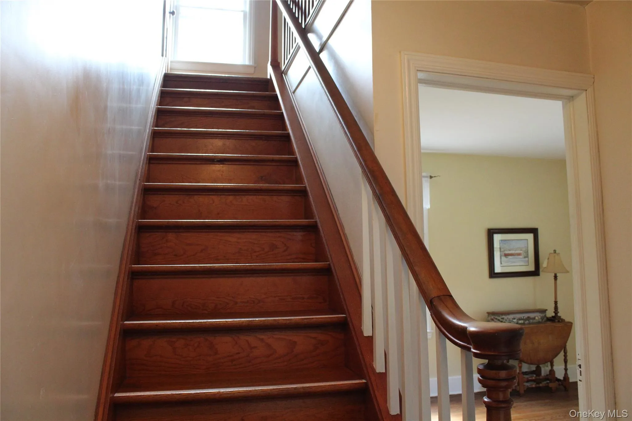 Hardwood staircase with a detailed newel post and balusters Hardwood staircase with a detailed newel post and balusters