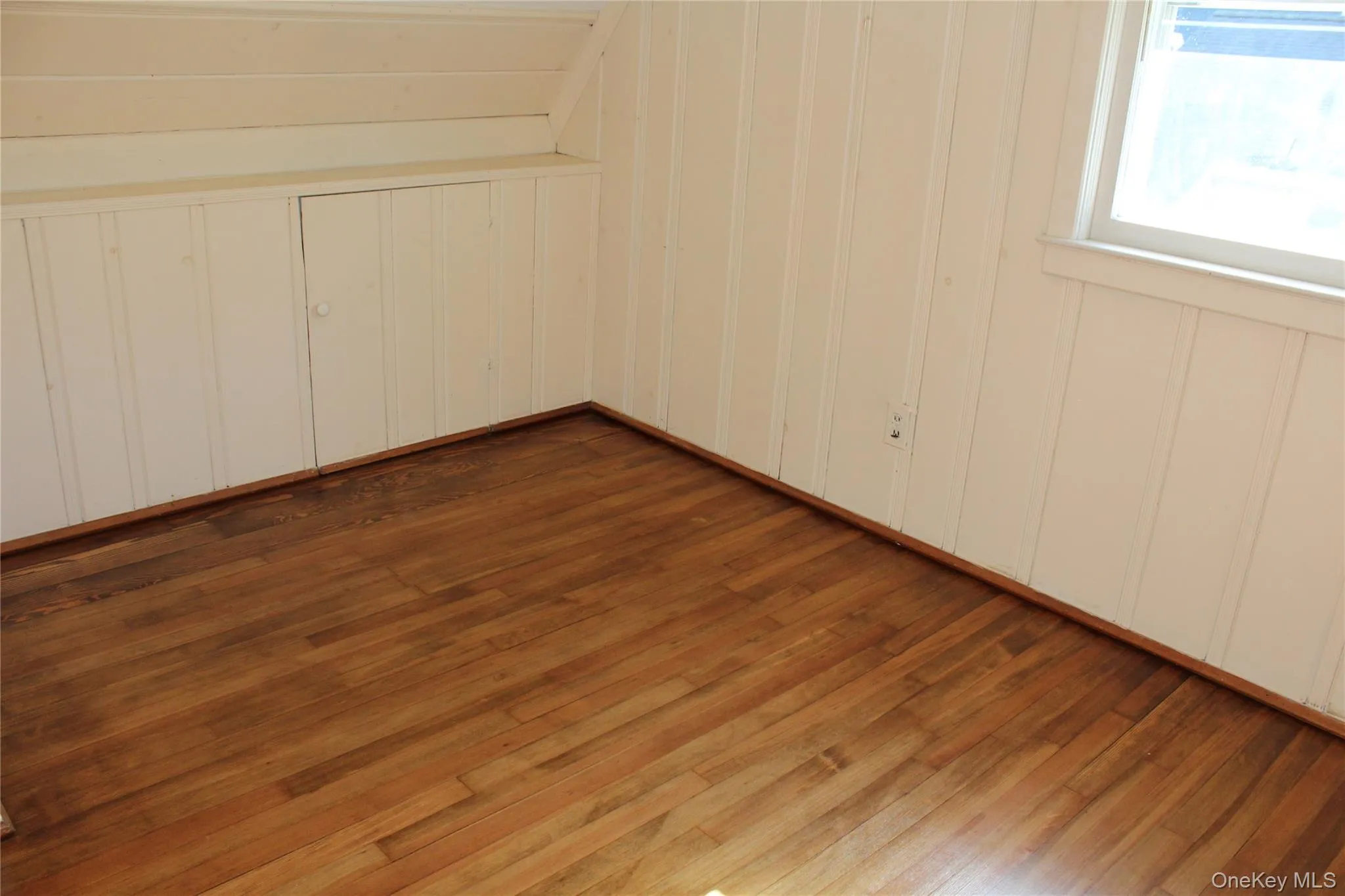 Wood flooring with tongue and groove walls and built-in storage closets and additional closet Wood flooring with tongue and groove walls and built-in storage closets and additional closet