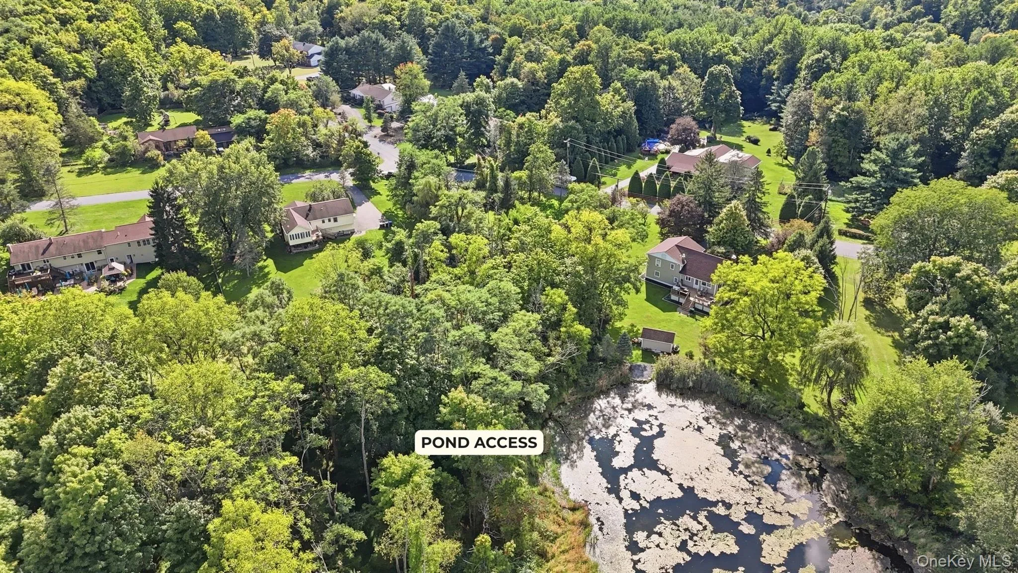 Pond access in the back corner of the lot. Pond access in the back corner of the lot.