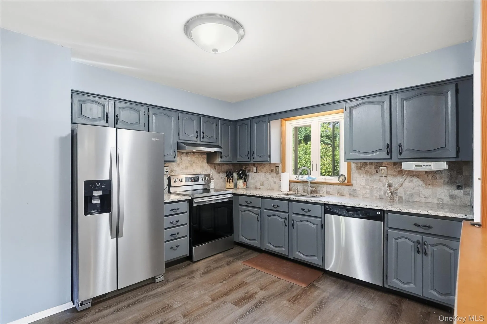 Kitchen equipped with stainless steel appliances Kitchen equipped with stainless steel appliances