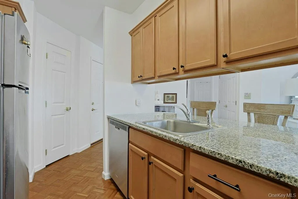 Maple cabinetry accessible from both sides with granite countertops Maple cabinetry accessible from both sides with granite countertops