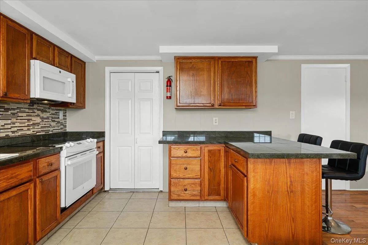 View of kitchen facing pantry closet. View of kitchen facing pantry closet.