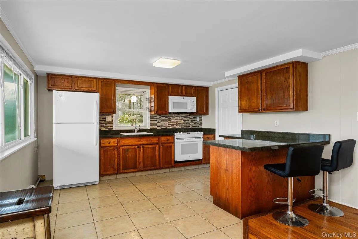 Kitchen area includes lake views, sunlight, pantry space and breakfast bar. Kitchen area includes lake views, sunlight, pantry space and breakfast bar.