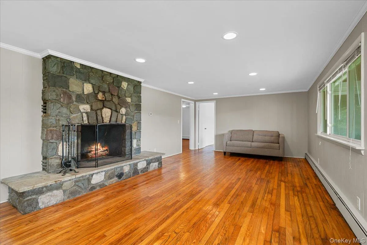 Hardwood Floors and woodburning stone fireplace. Hardwood Floors and woodburning stone fireplace.