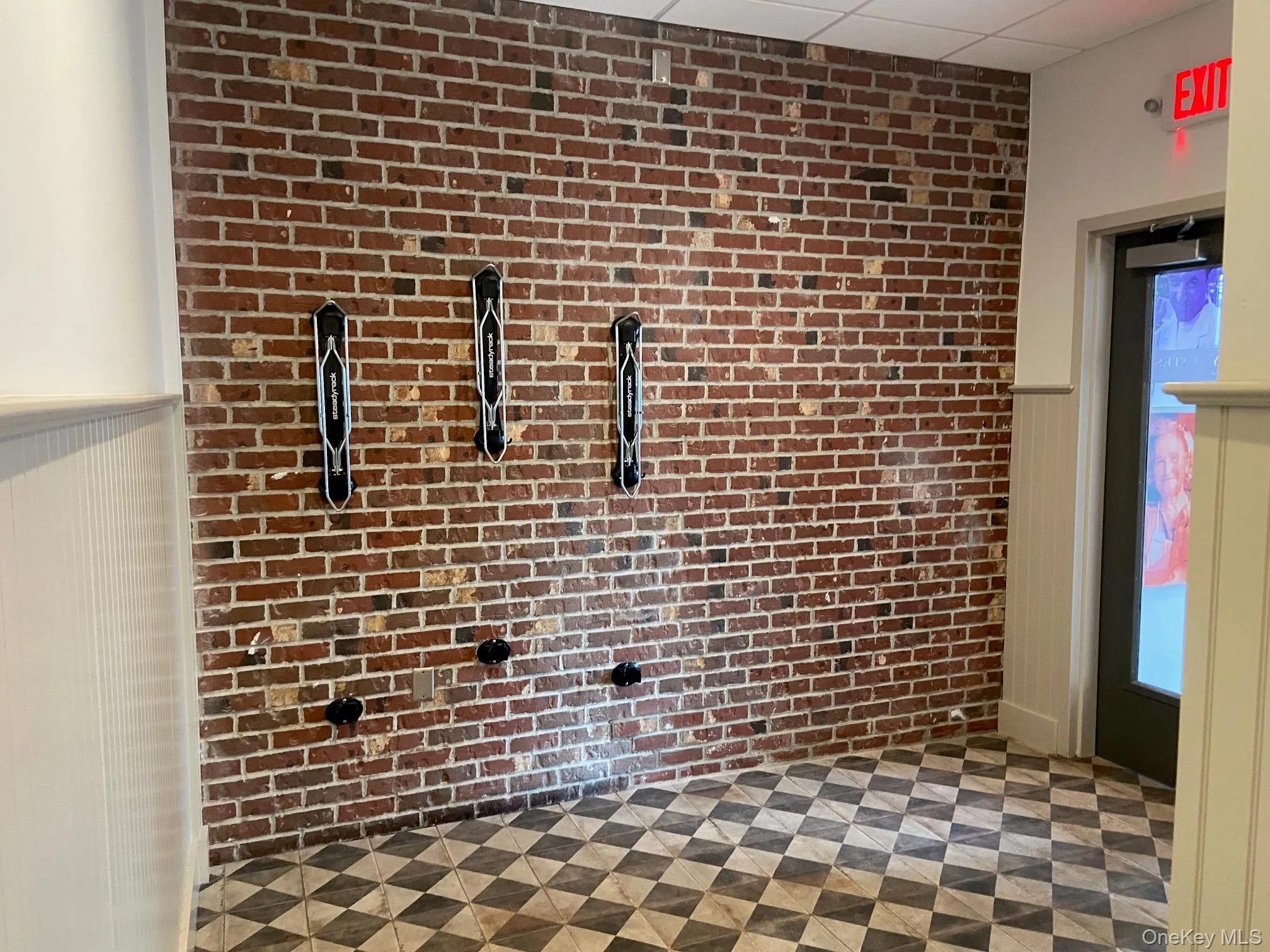 Detailed view of brick wall and a wainscoted wall Detailed view of brick wall and a wainscoted wall