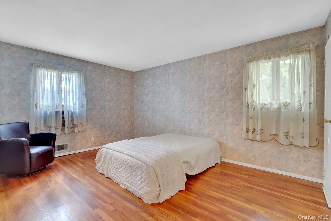 Primary Bedroom with Hardwood flooring Primary Bedroom with Hardwood flooring