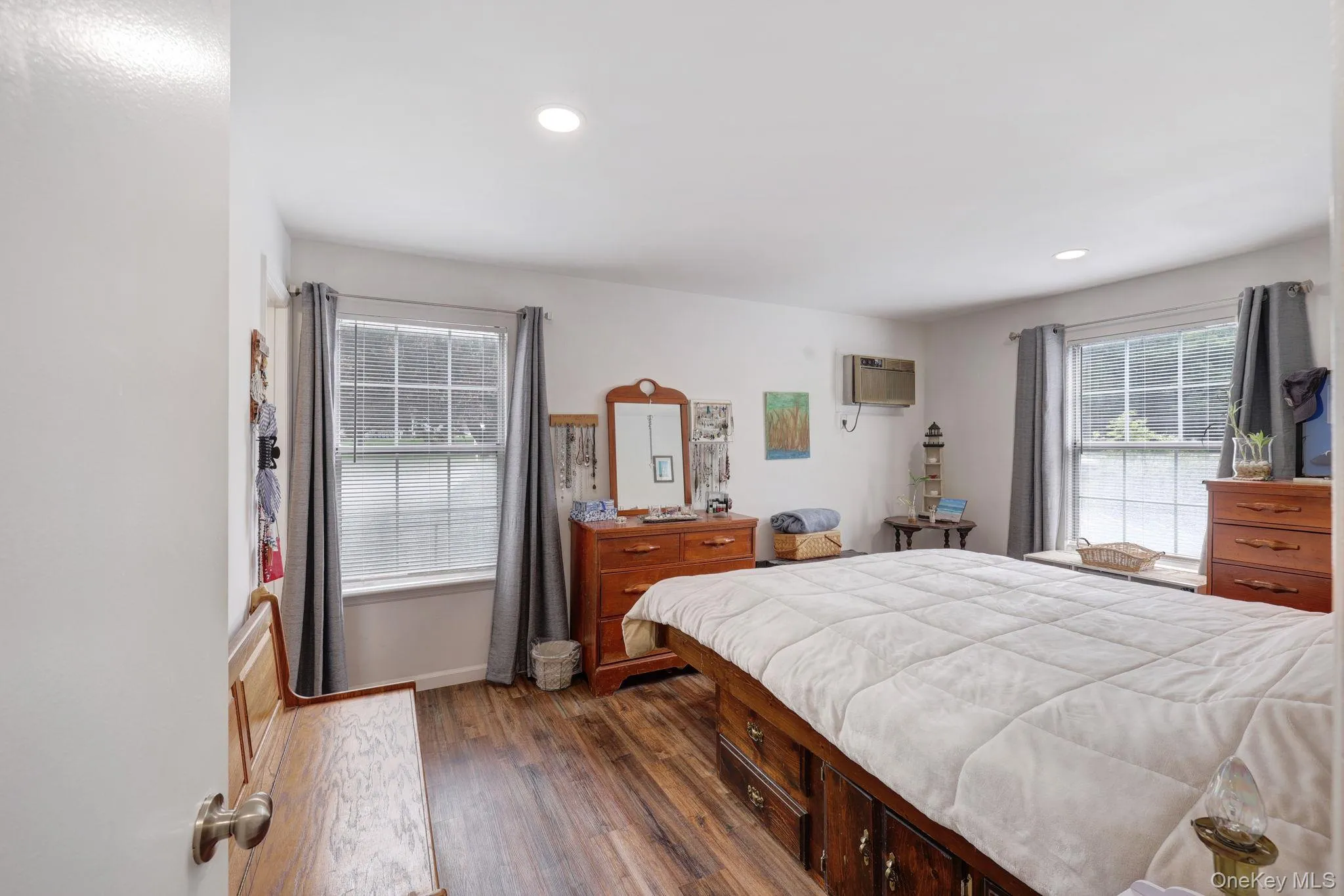 Recessed lighting, wood-finish flooring, and multiple windows Recessed lighting, wood-finish flooring, and multiple windows