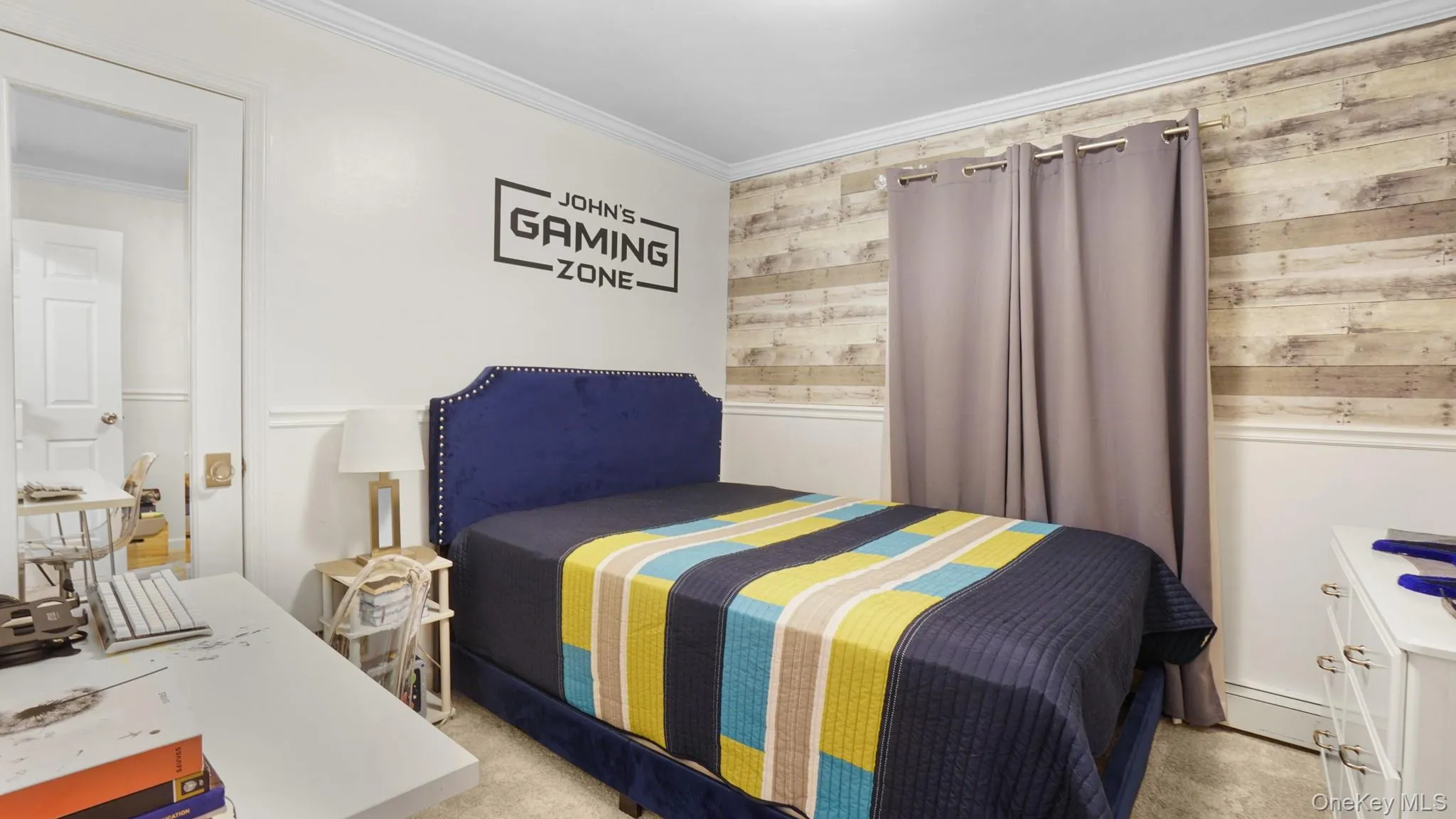 Bedroom featuring crown molding, carpet flooring, and wooden walls Bedroom featuring crown molding, carpet flooring, and wooden walls