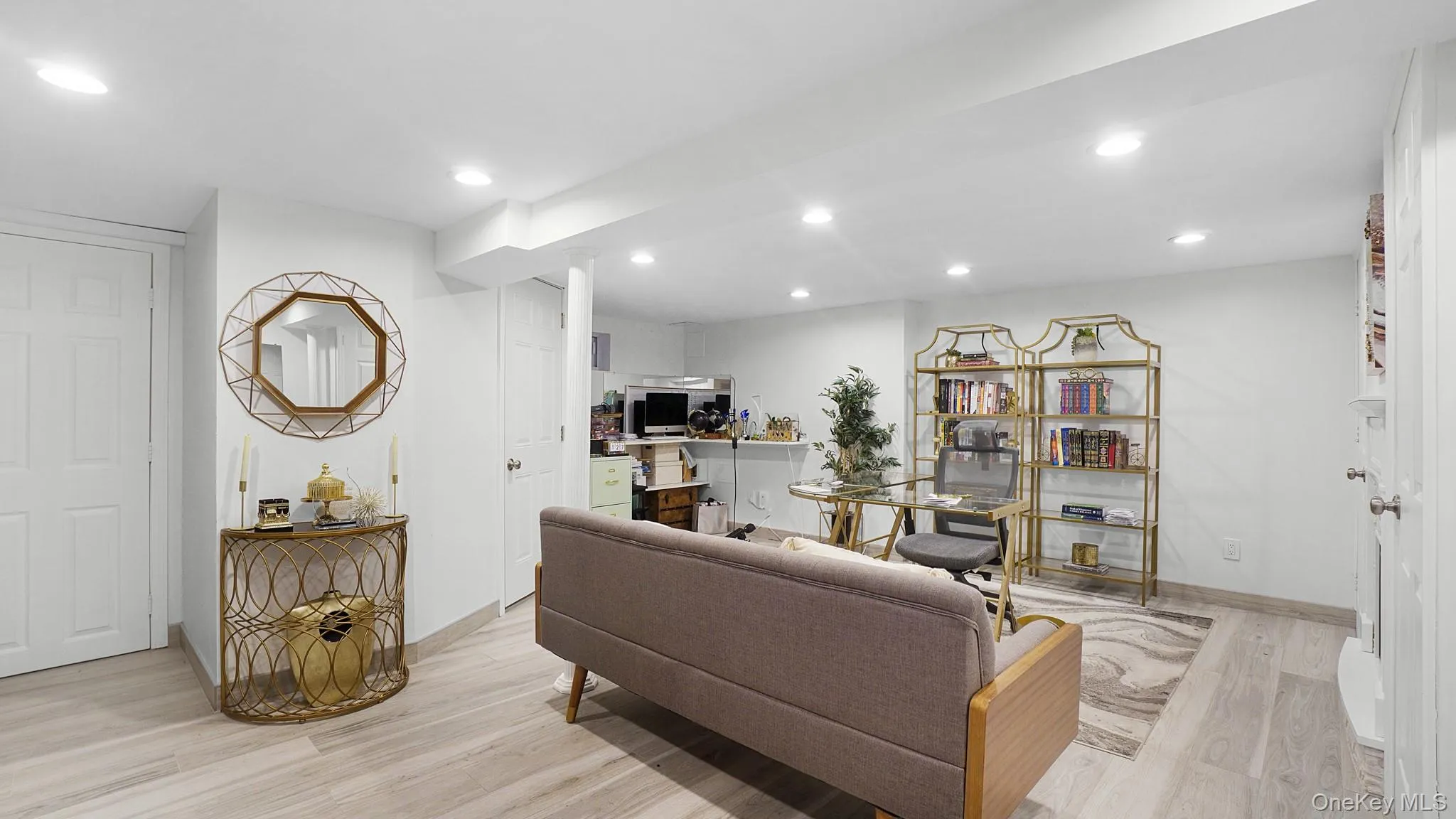 Living room featuring light wood finished floors and recessed lighting Living room featuring light wood finished floors and recessed lighting