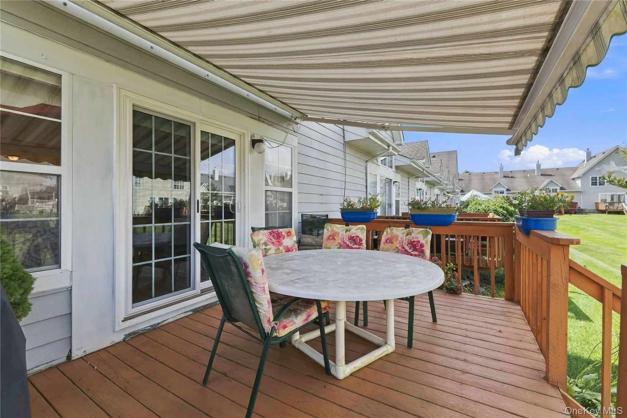 Rear deck with retractable awning opened Rear deck with retractable awning opened