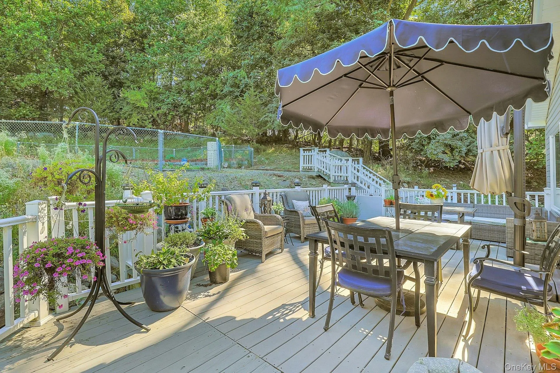 The expansive deck wraps around the back of the house and adjoins the steps that lead you to the private pool area. The expansive deck wraps around the back of the house and adjoins the steps that lead you to the private pool area.