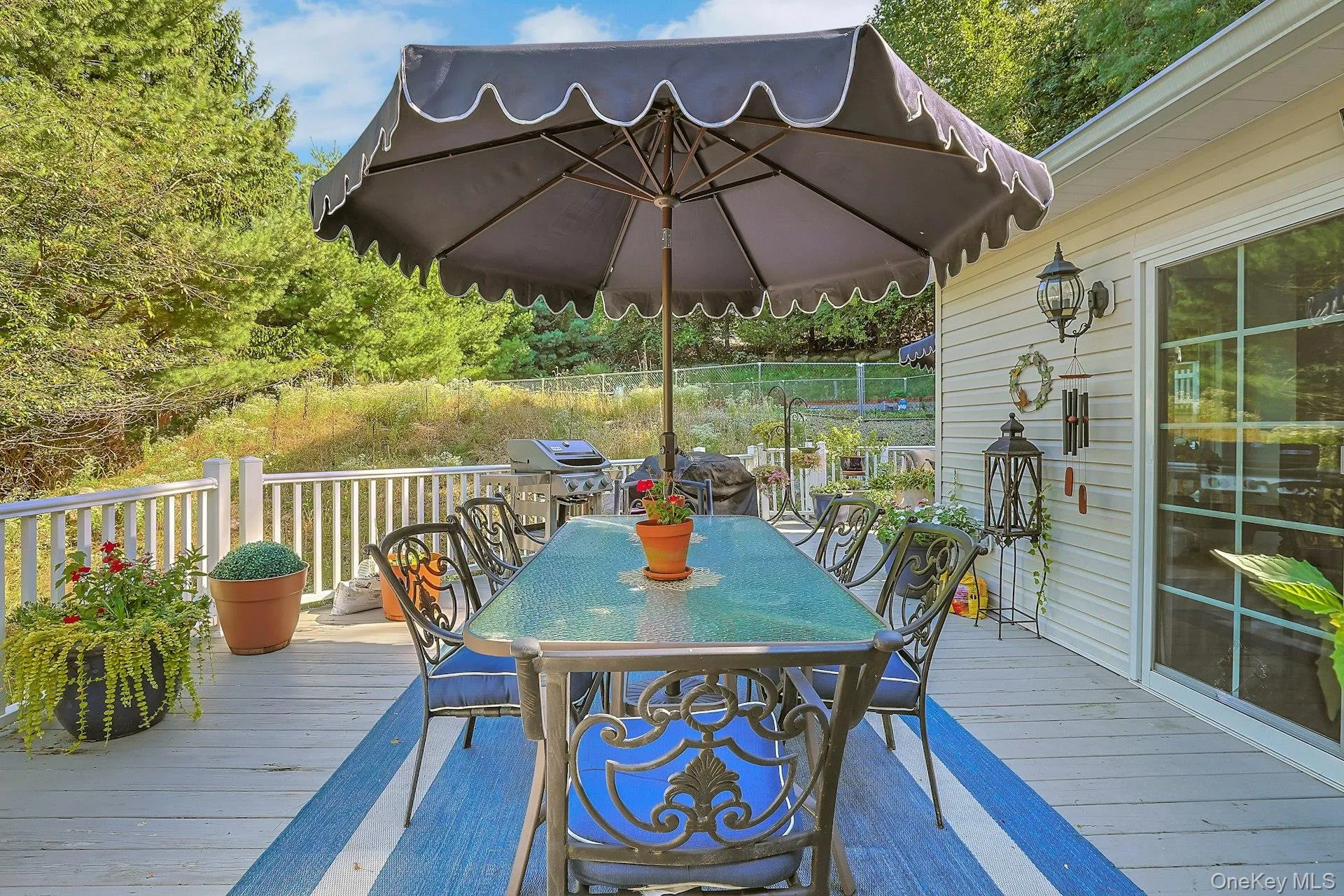 The wrap-around deck is quite expansive and can fit lots of patio furniture. See next photos ... The wrap-around deck is quite expansive and can fit lots of patio furniture. See next photos ...