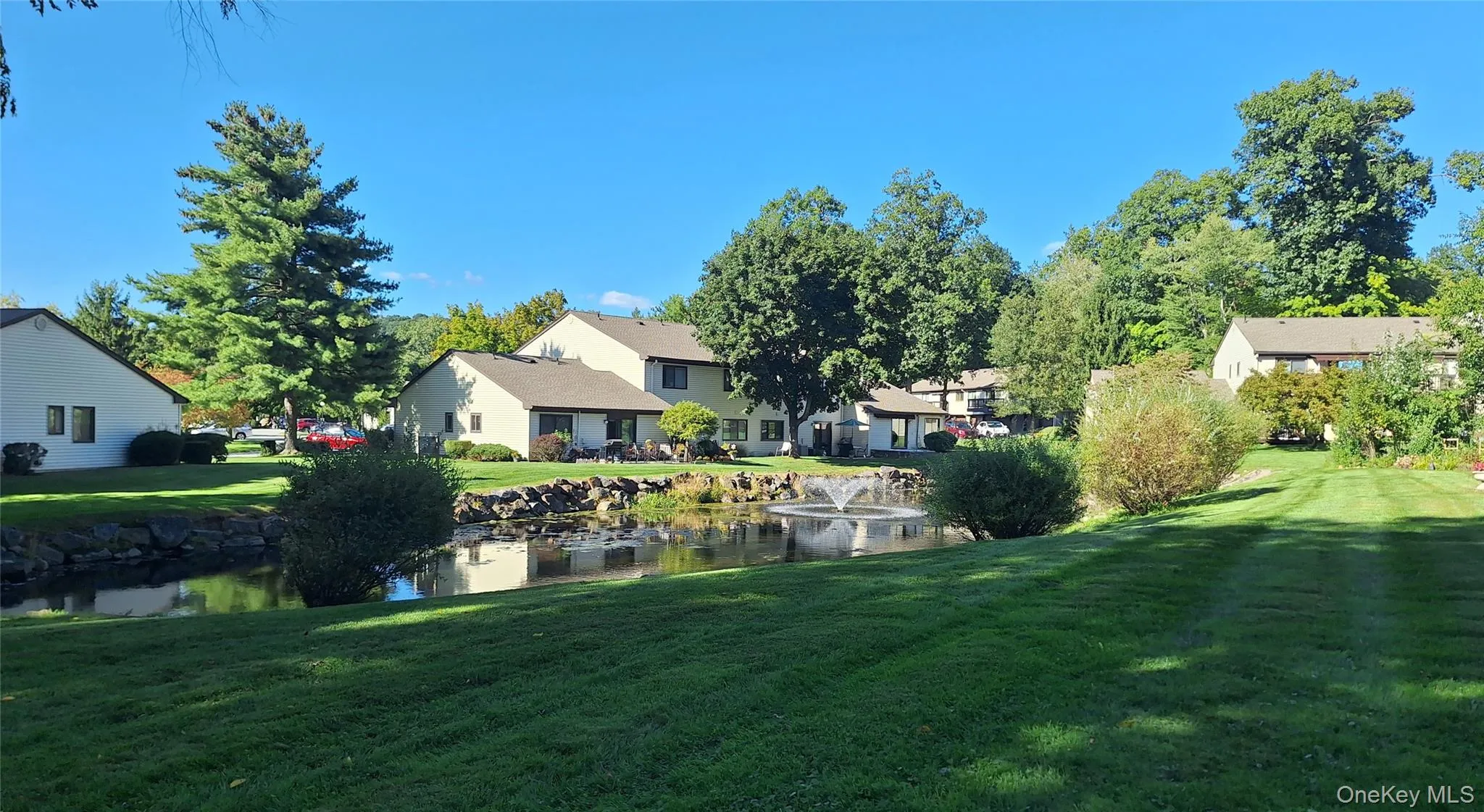 Beautiful water feature in the back with greenery and nature. Beautiful water feature in the back with greenery and nature.