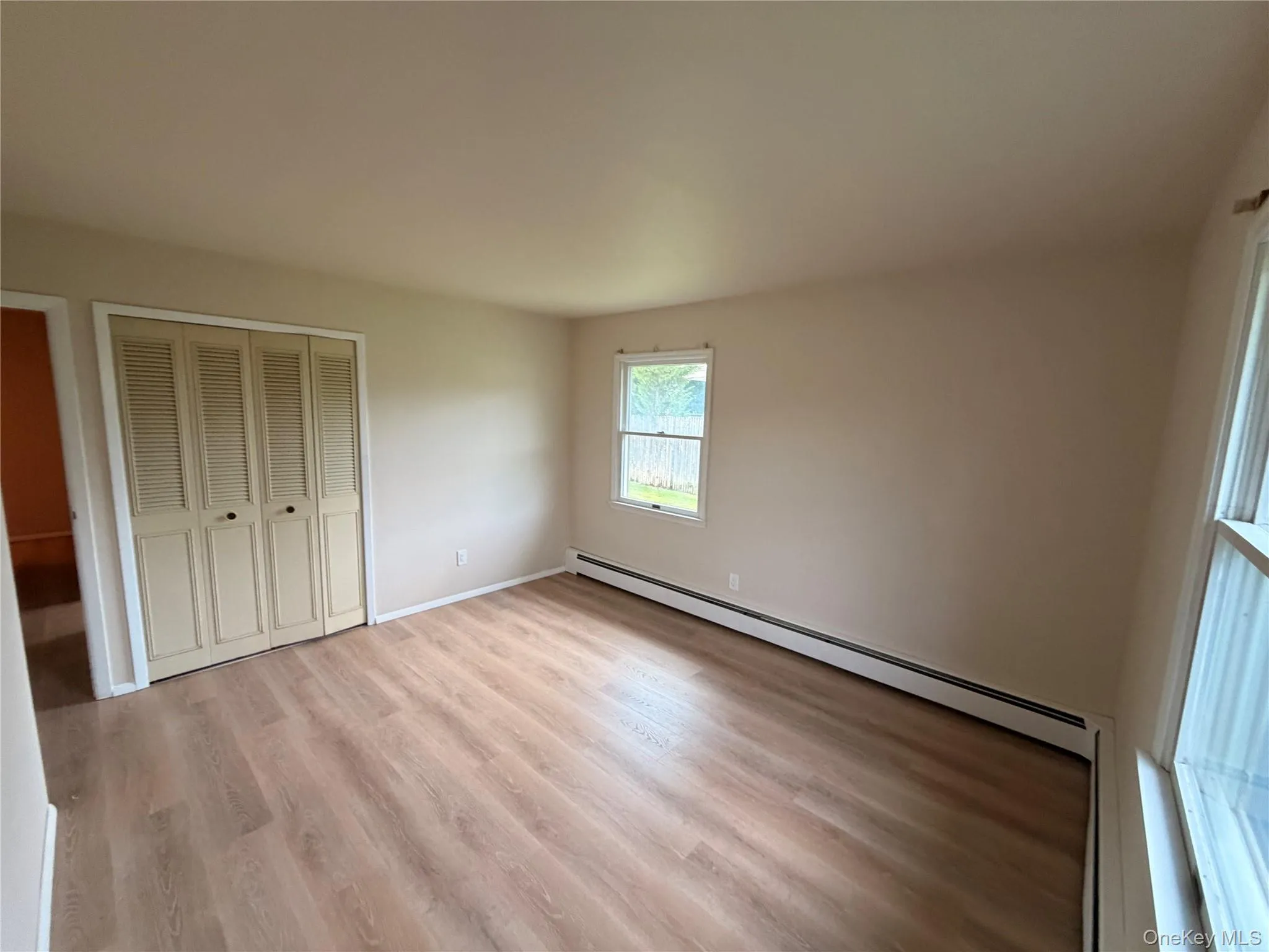 Wood-finish flooring throughout, complemented by light neutral wall tones Wood-finish flooring throughout, complemented by light neutral wall tones