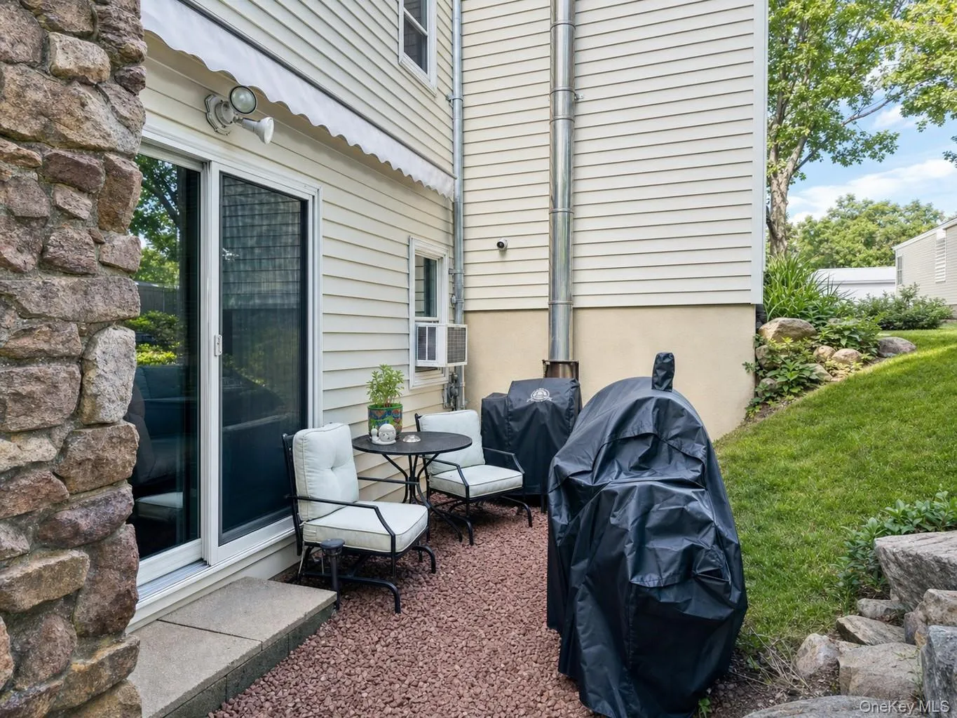 Pebble patio is perfect for grilling and relaxing! Pebble patio is perfect for grilling and relaxing!