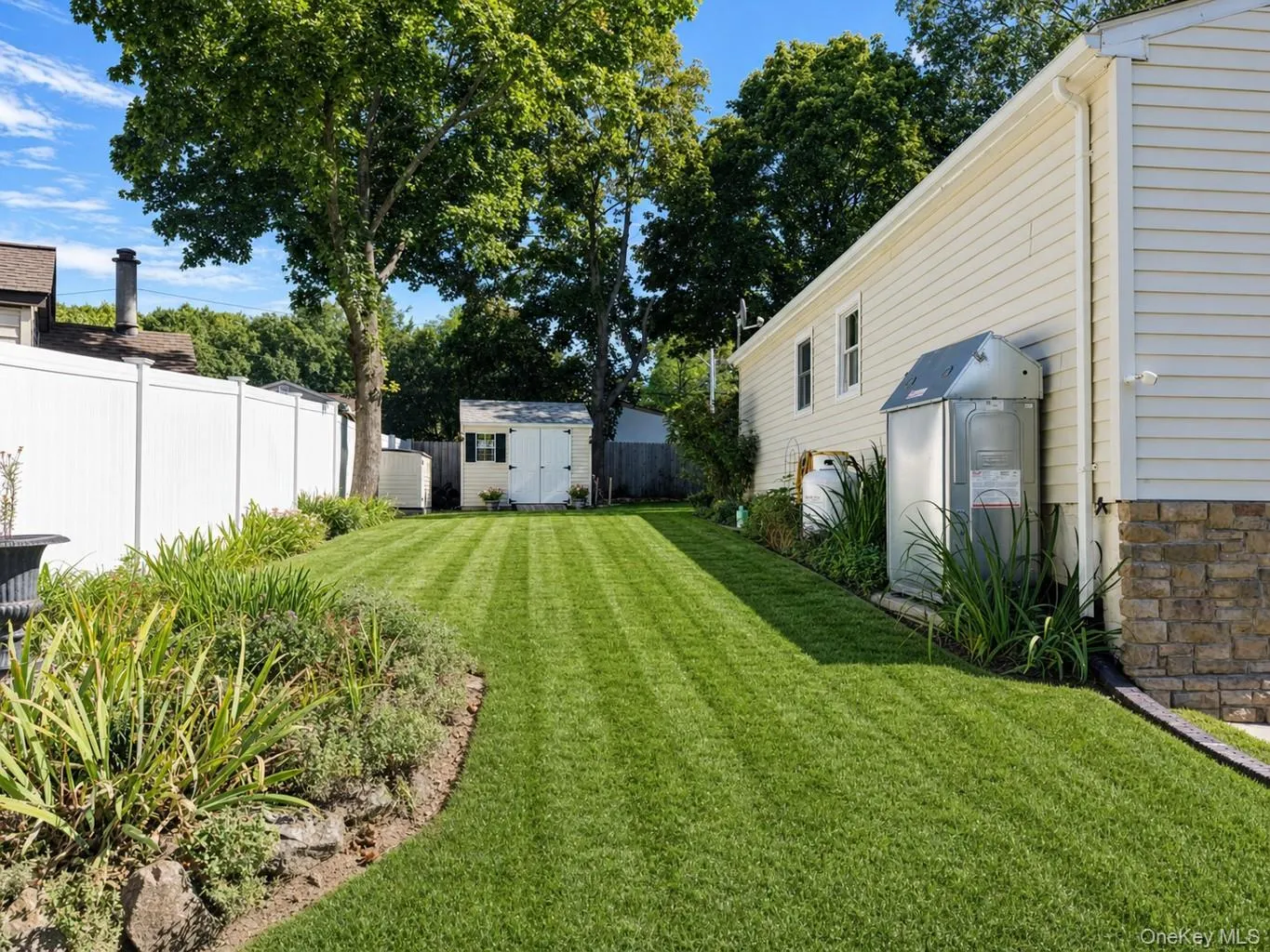Lush grass and lovely landscaping surrounds this wonderful home! Lush grass and lovely landscaping surrounds this wonderful home!