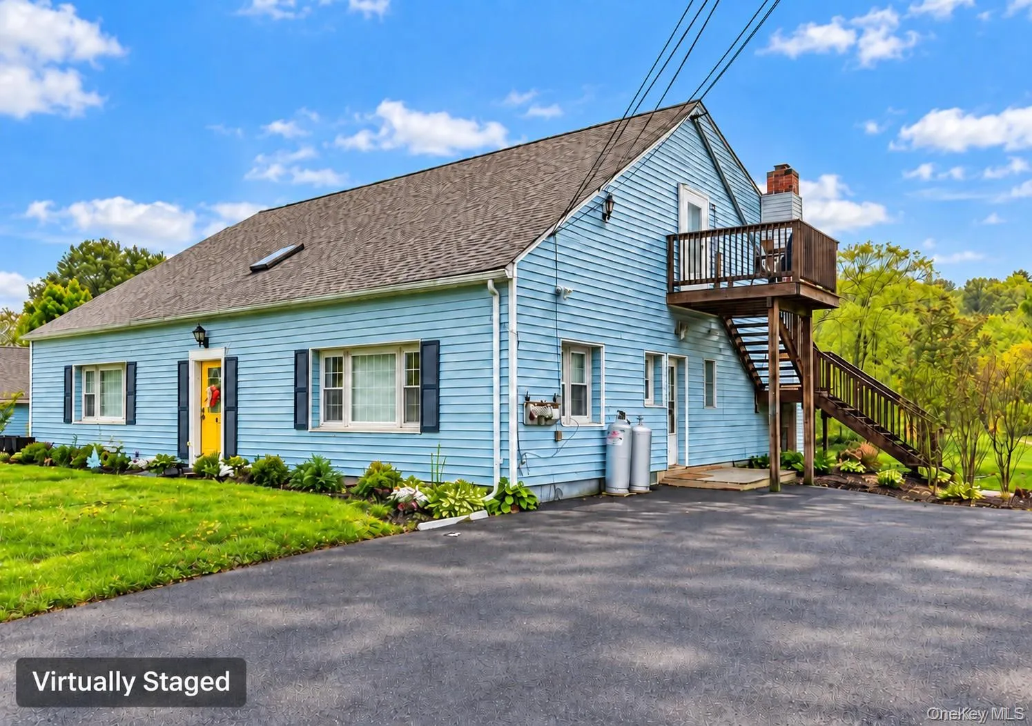 Light blue horizontal siding and a dark shingle roof Light blue horizontal siding and a dark shingle roof