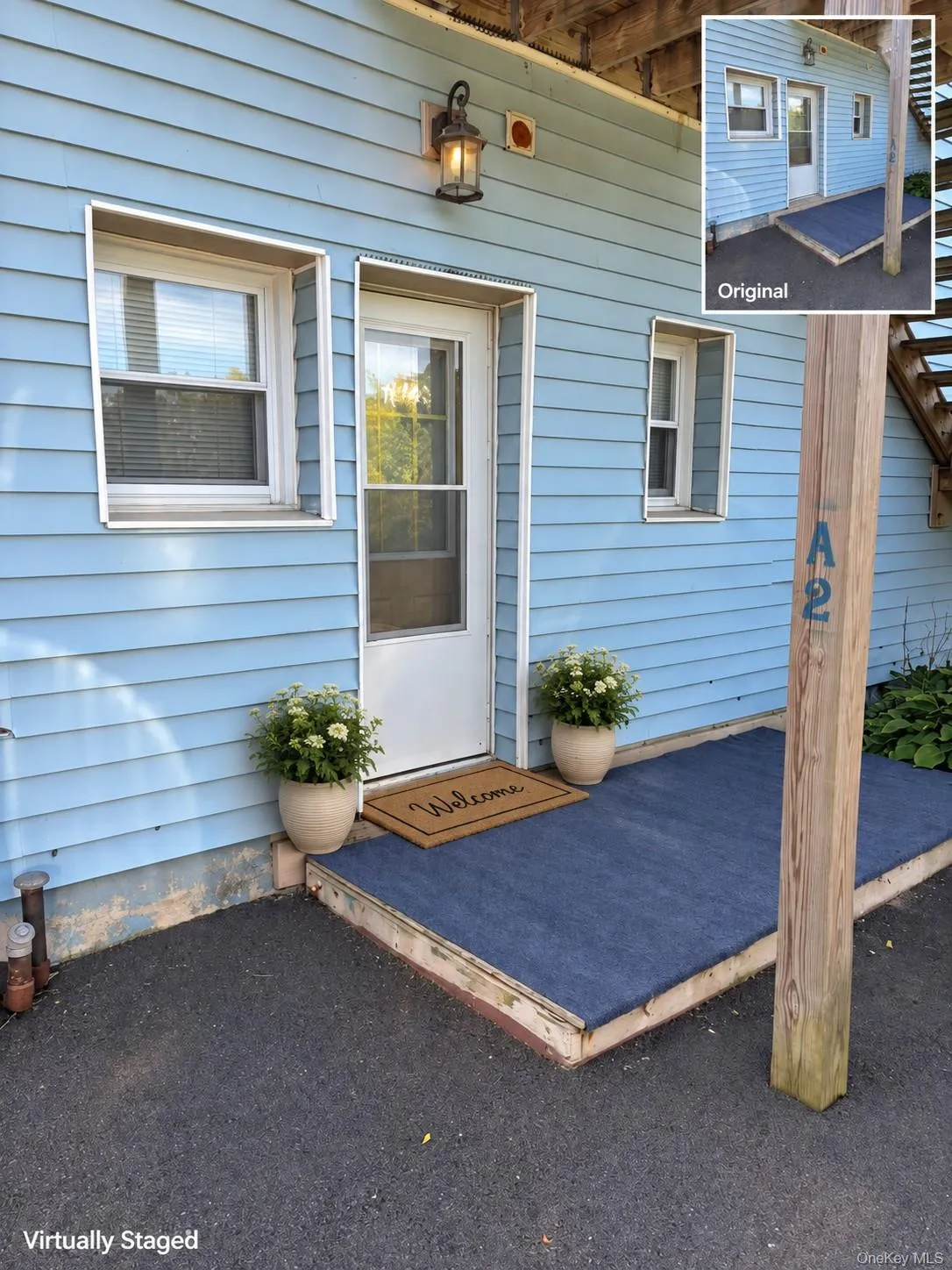 Blue horizontal siding exterior with white trim windows and an outdoor wall sconce Blue horizontal siding exterior with white trim windows and an outdoor wall sconce