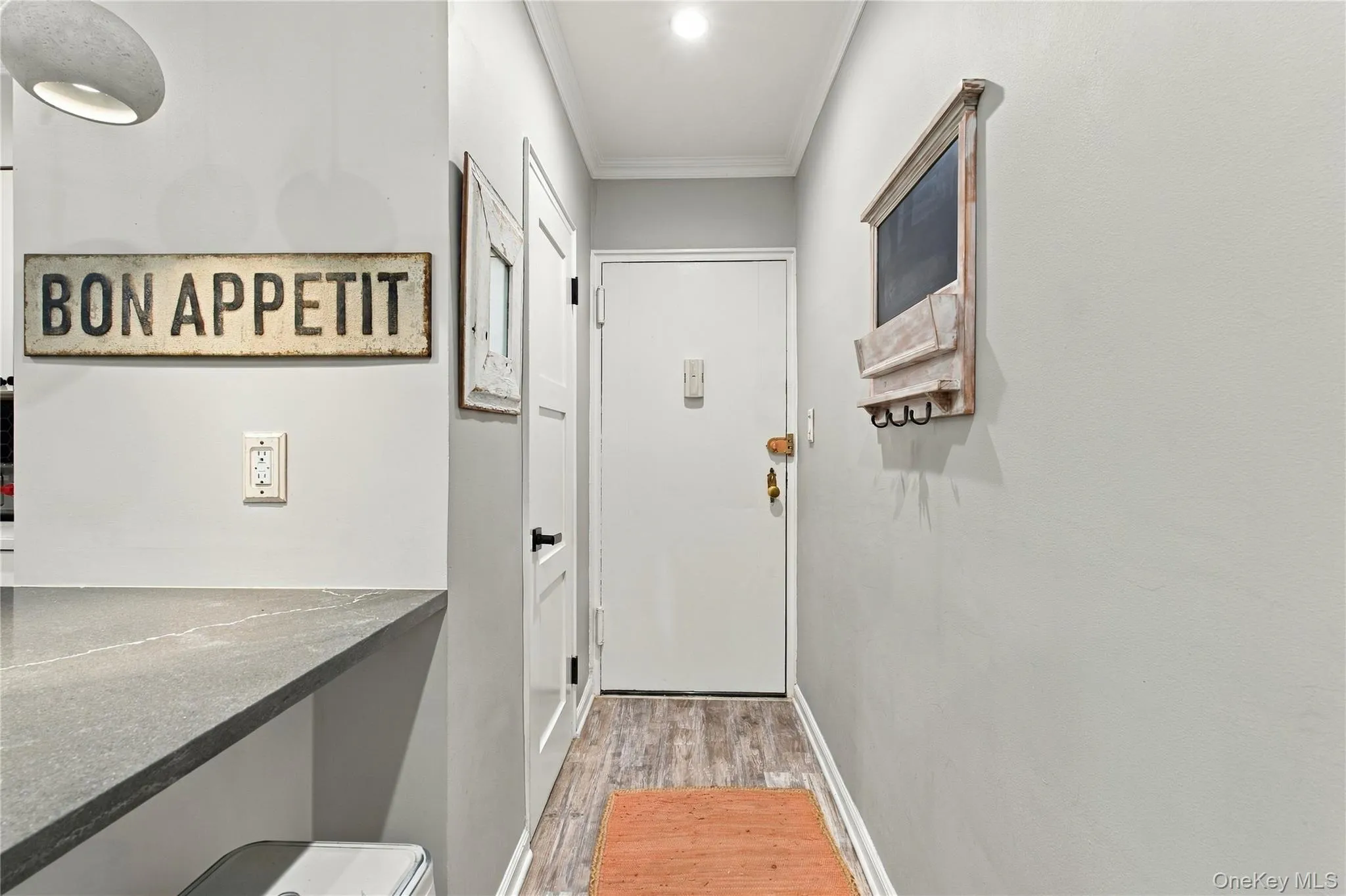 A welcoming entryway features a spacious coat closet and flows seamlessly into the kitchen, creating an open and functional layout. A welcoming entryway features a spacious coat closet and flows seamlessly into the kitchen, creating an open and functional layout.