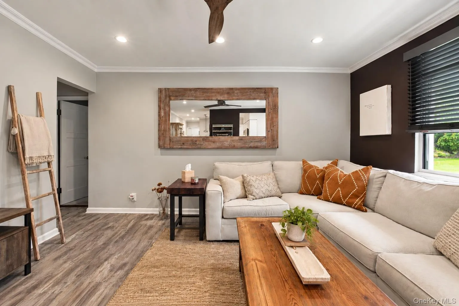 Bright and airy living room featuring custom blinds and tasteful decor. Bright and airy living room featuring custom blinds and tasteful decor.
